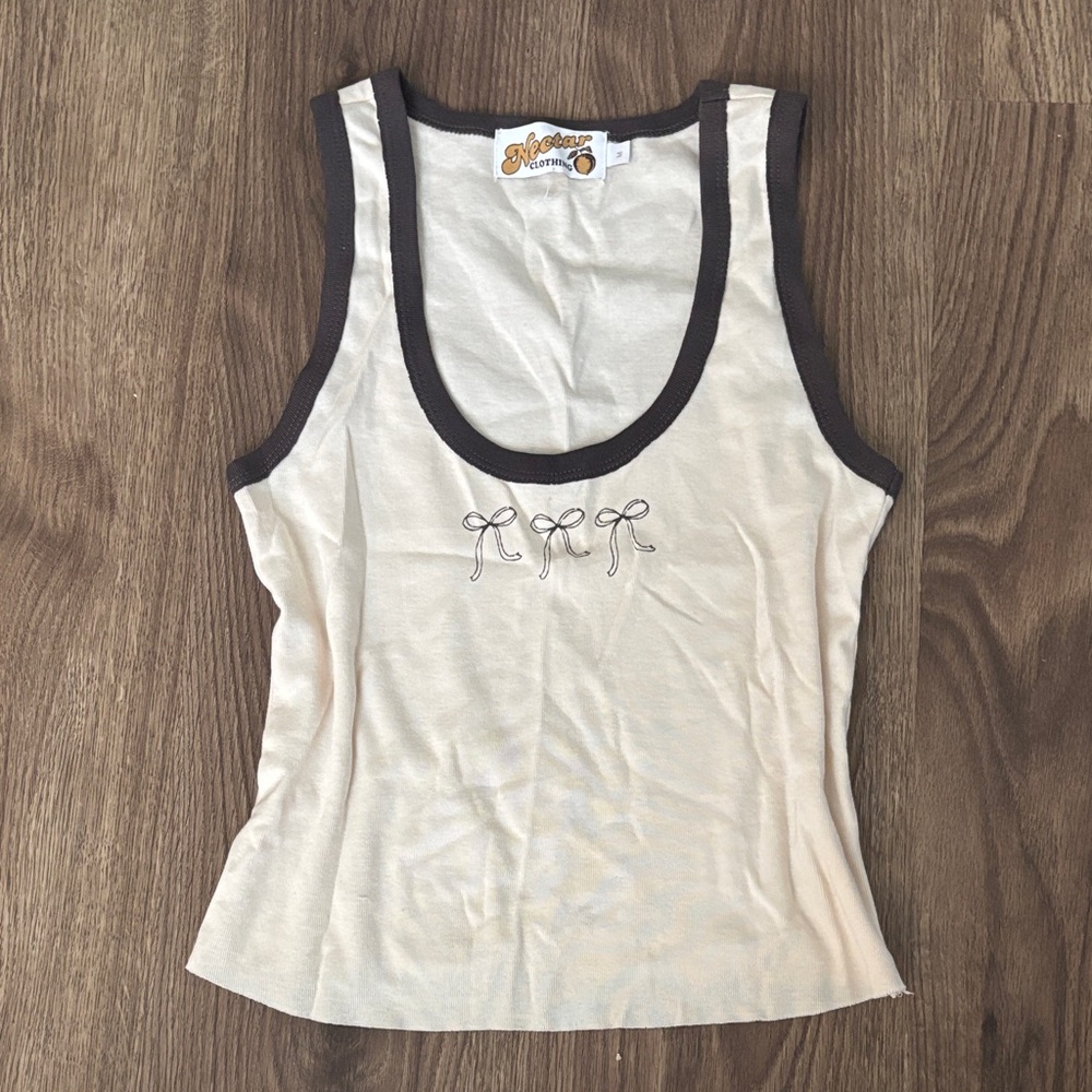 Stylish Cream Tank Top with Black Trim